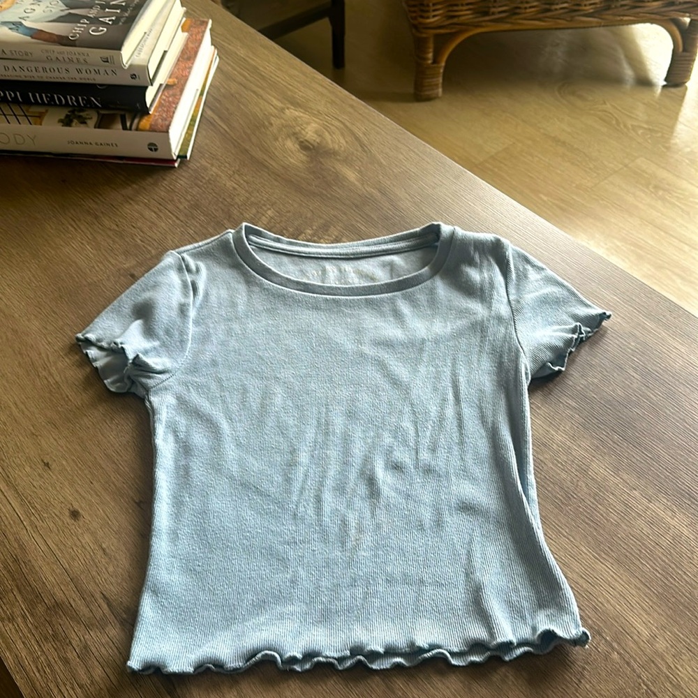 Cropped tight to body but stretchy super cute tee!